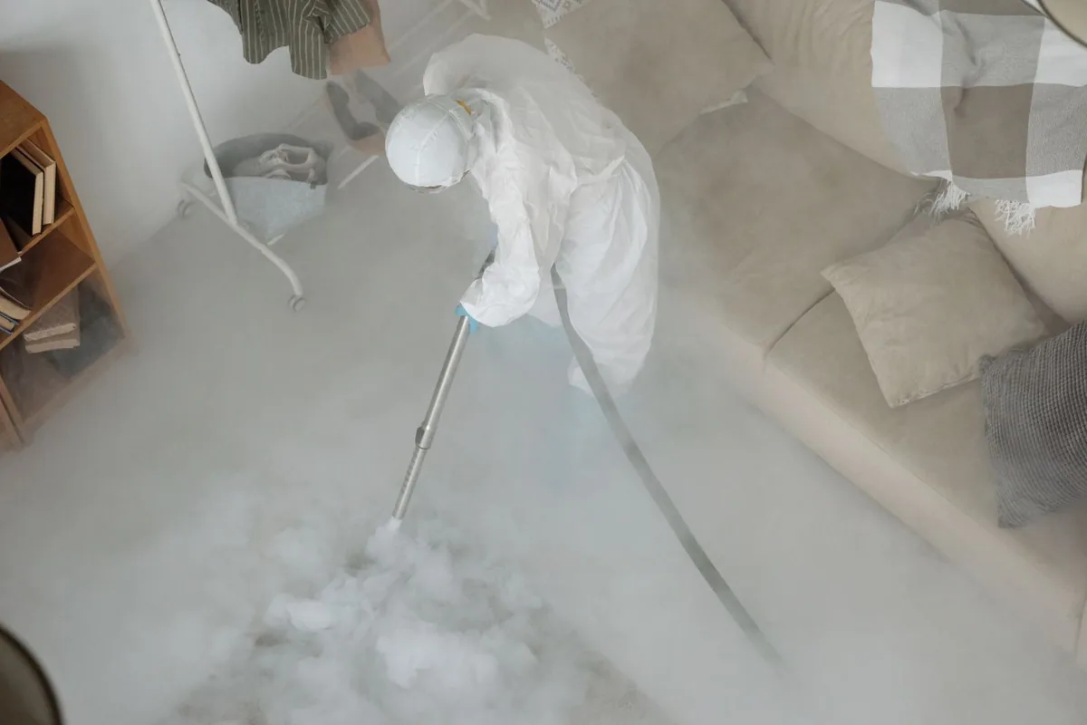 Biohazard cleanup technician in protective equipment, Carbon Hill, AL